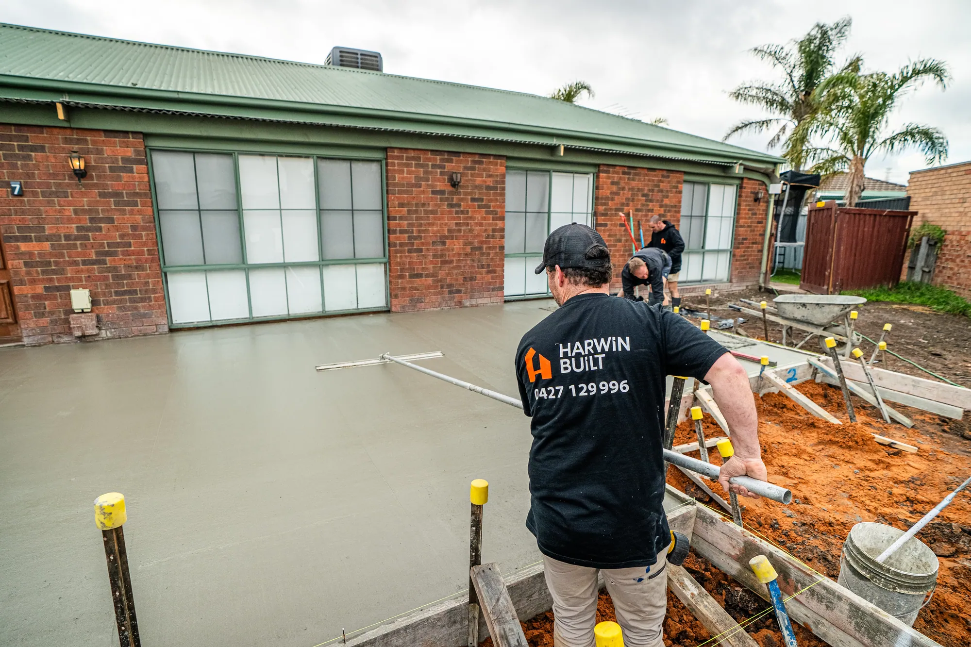The crew screeding a slab together