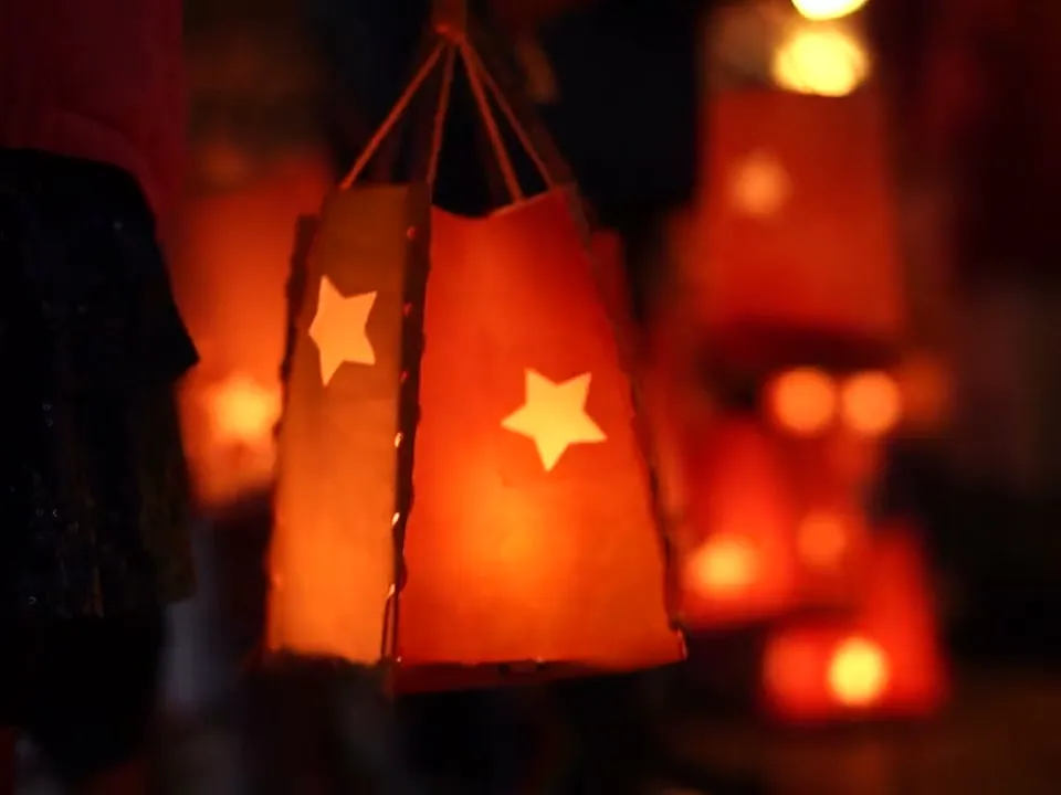 Paper lanterns glowing at a winter festival
