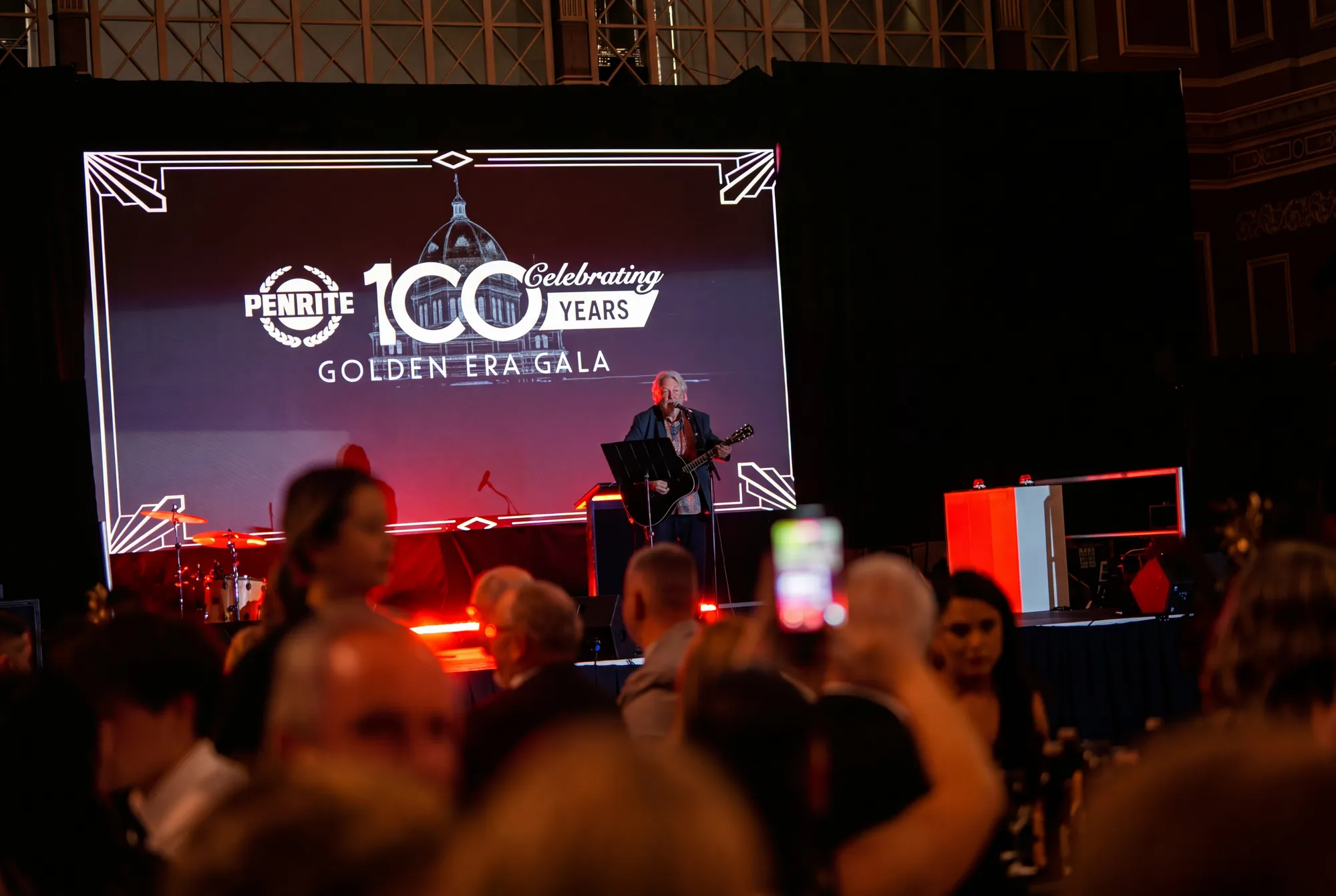 Guests watching a performer on stage at Penrite's 100-year gala