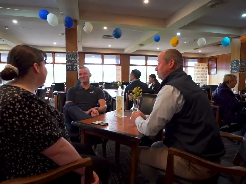 Business owners talking at a networking breakfast
