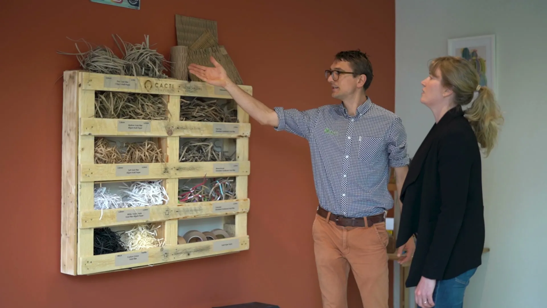 Jackson showing a client the product wall