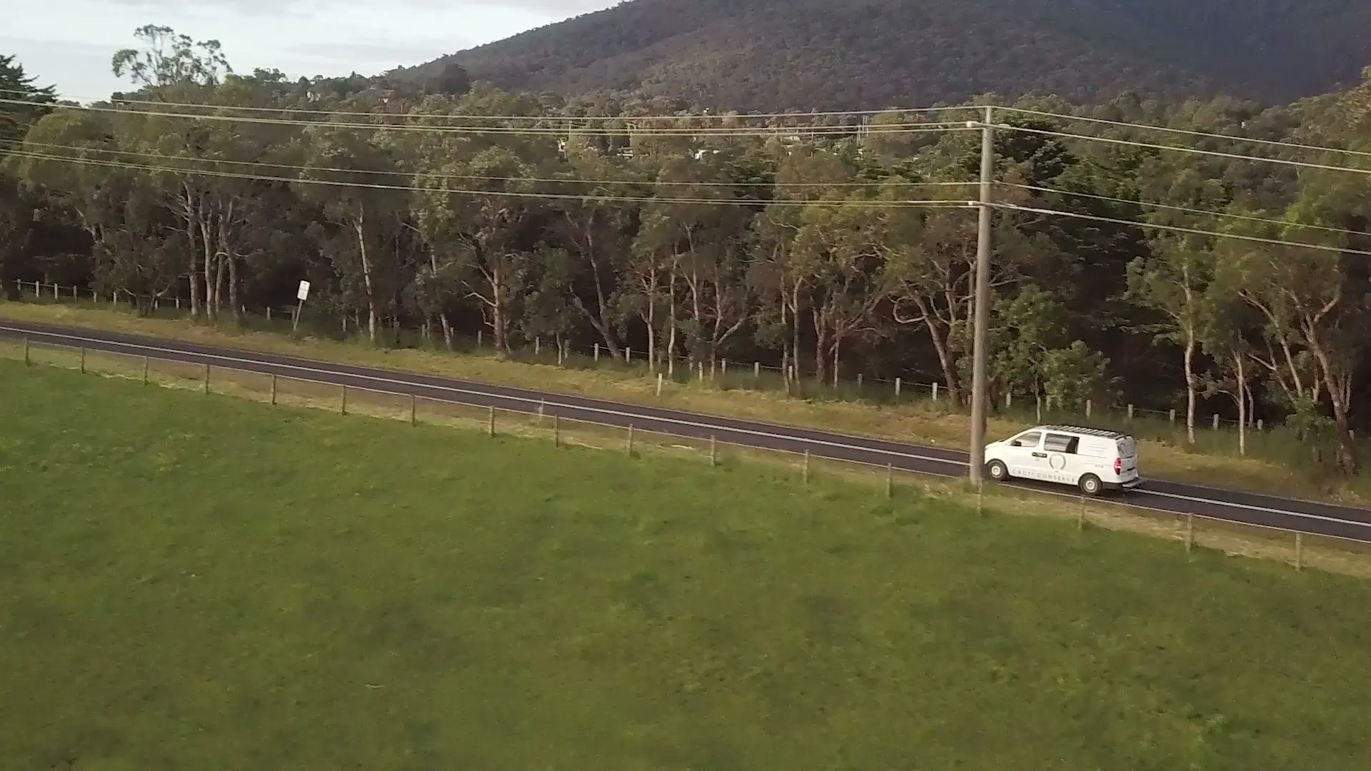 Drone shot of the Cacti Conserve van on a road beside the Dandenong Ranges