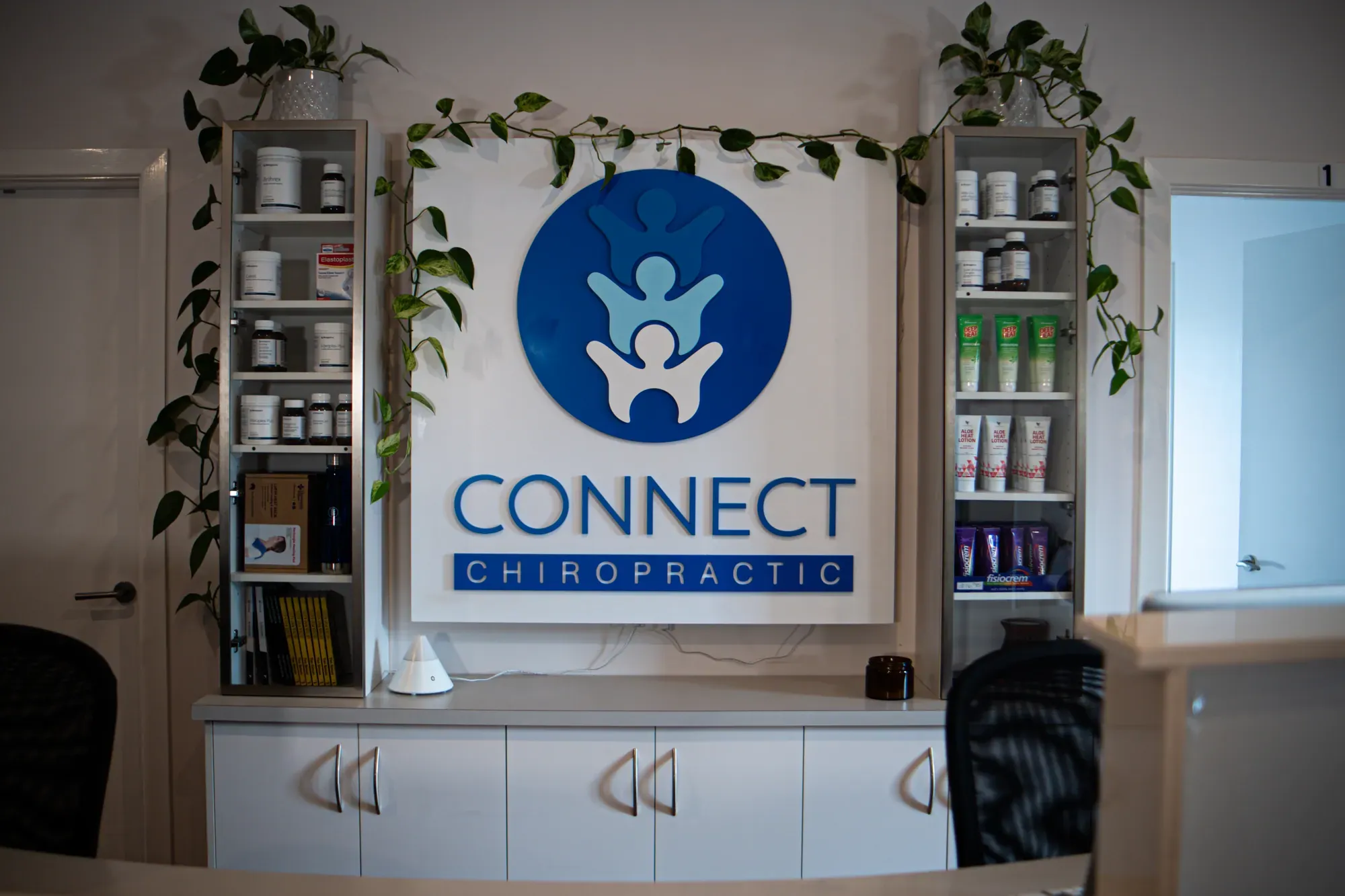 The Connect Chiropractic logo wall at reception